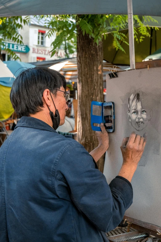 a man is in an umbrella area painting