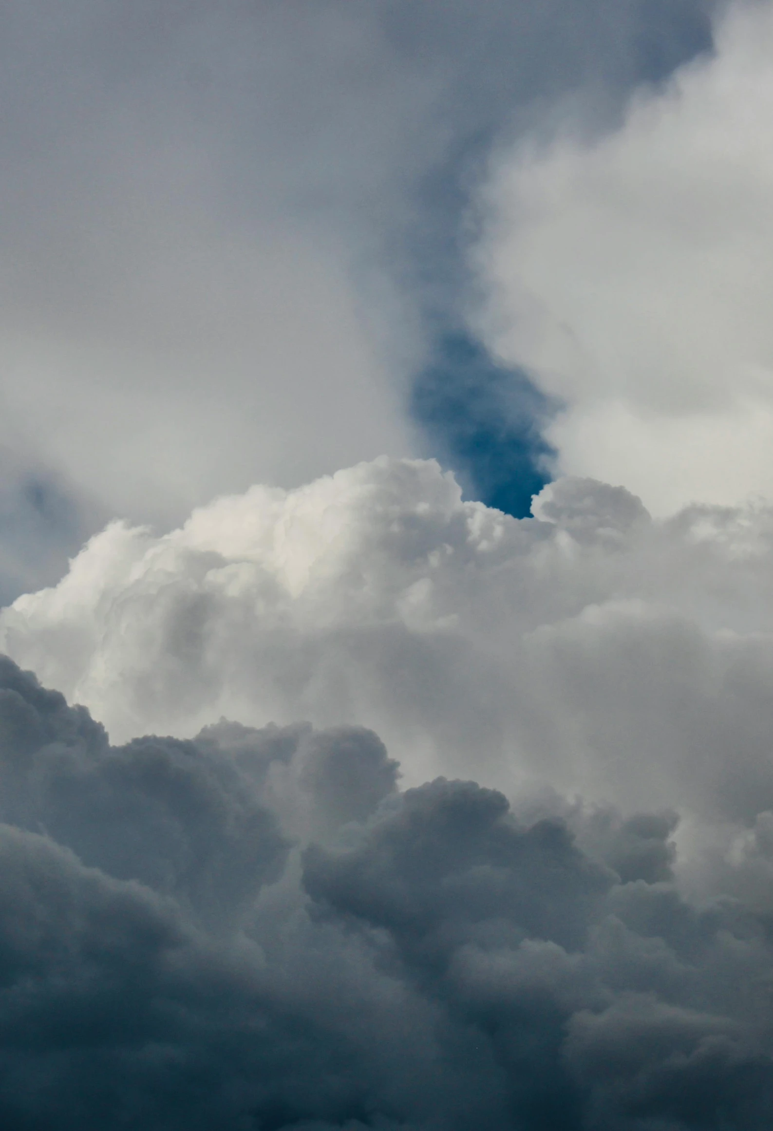 clouds move through the sky, a jet is flying in the air