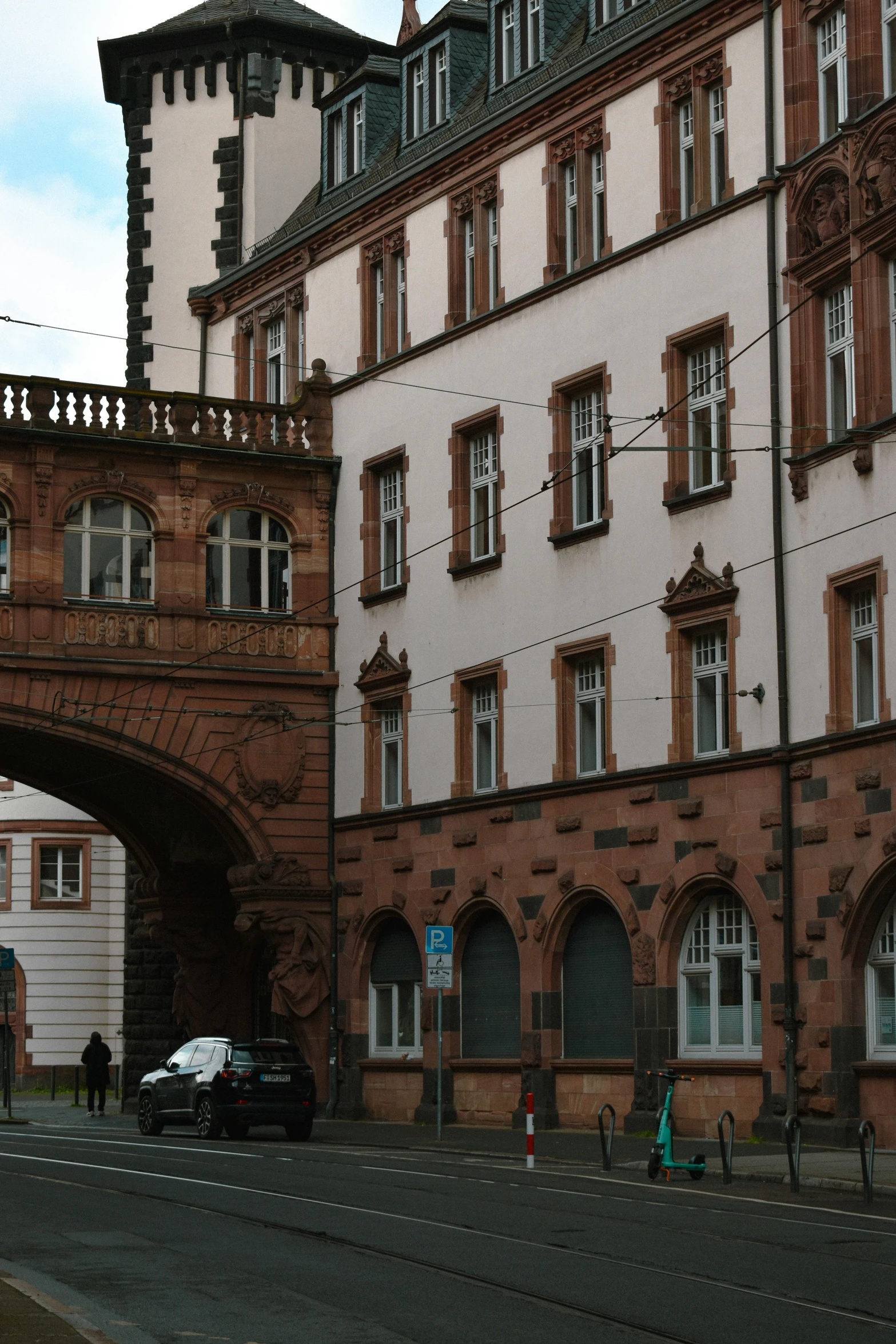 a brick building with a bridge over it