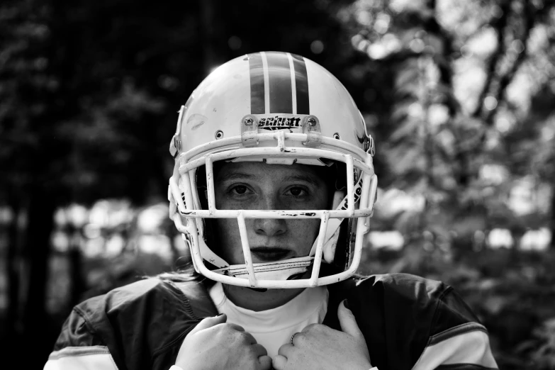 a  with a football helmet in black and white