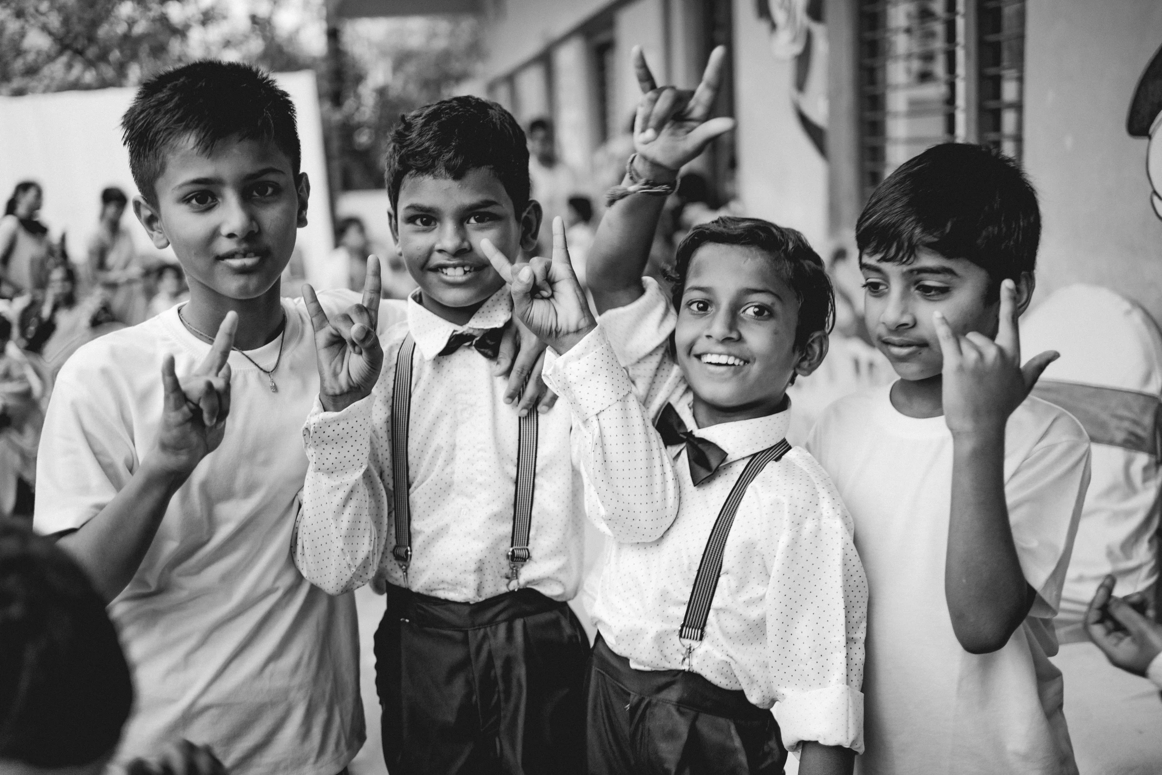 black and white pograph of a group of students waving