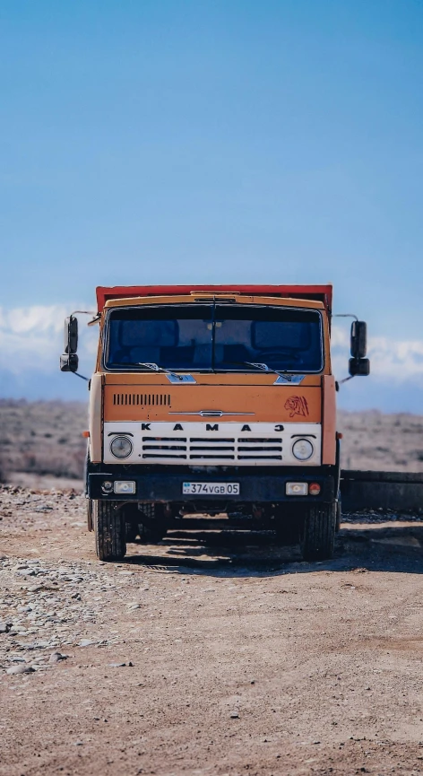 a truck parked in a desert like area