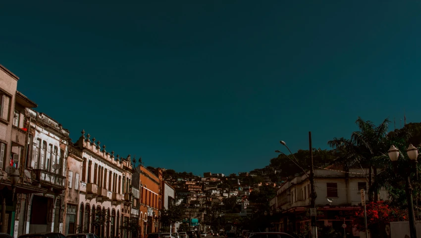 a very busy city street has traffic lights and buildings