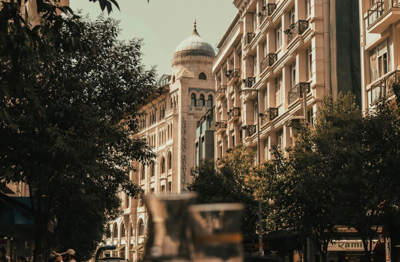 an image of a clock tower between buildings