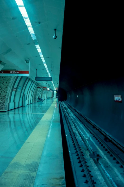 an empty subway train traveling under a tunnel