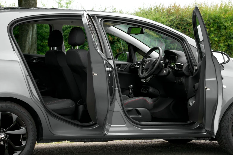 the side door and rear seats of a gray car