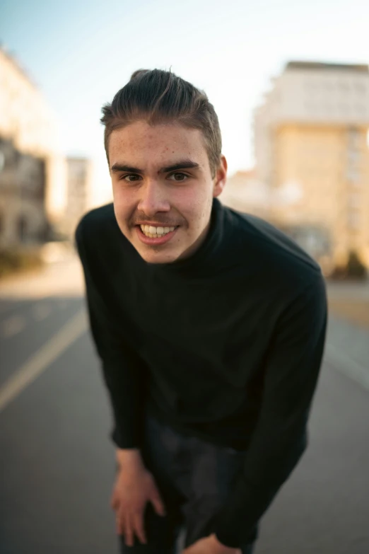 a person on a skateboard smiling at the camera