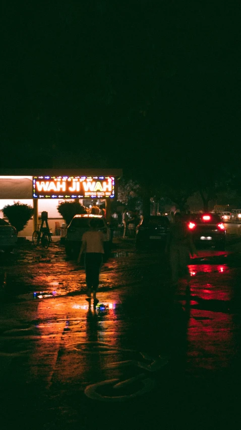 a person walking in the dark with an umbrella