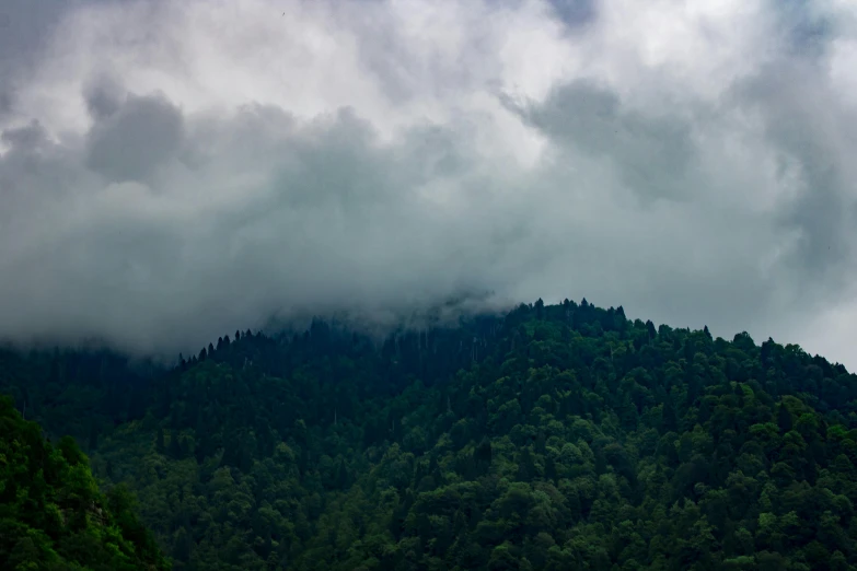 the mountain is covered with a lot of clouds