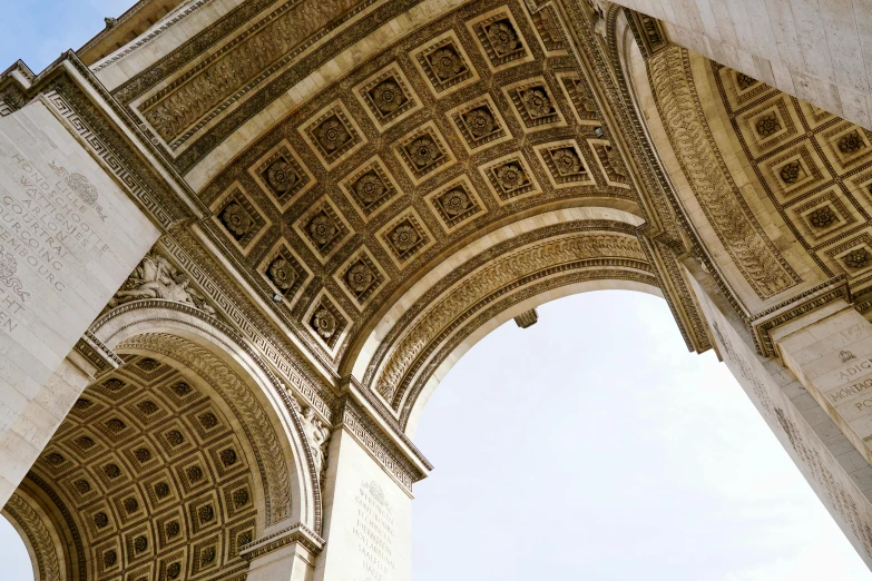 an ancient archway with a blue sky in the background