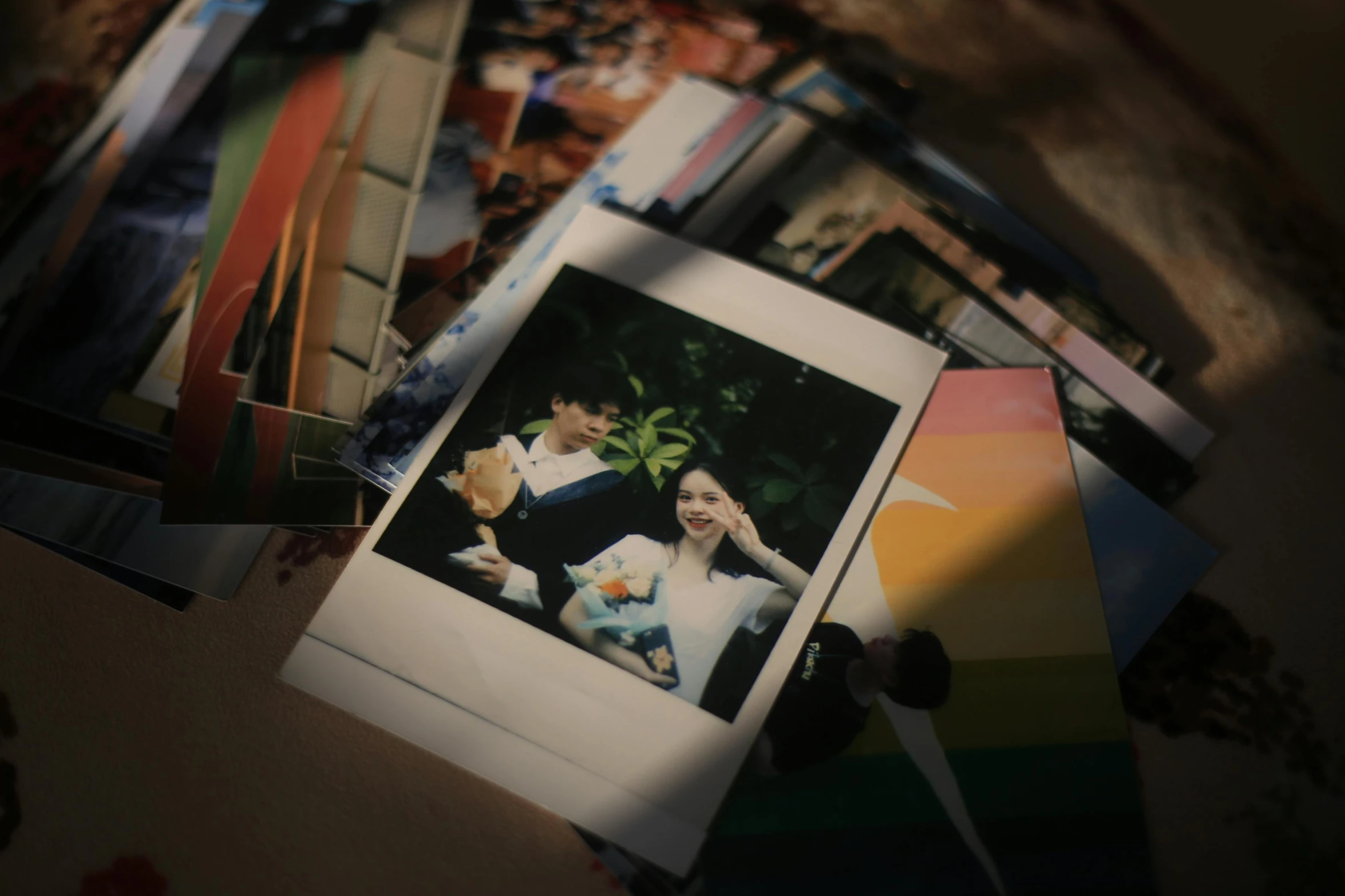 several polaroid pographs spread out on top of each other