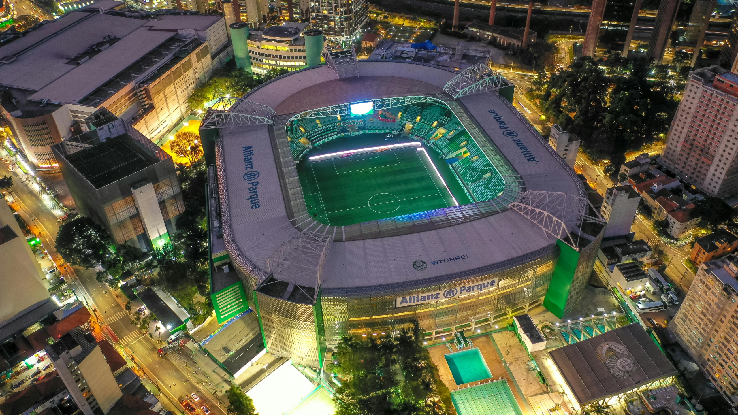 a soccer stadium with the lights on and on lit up