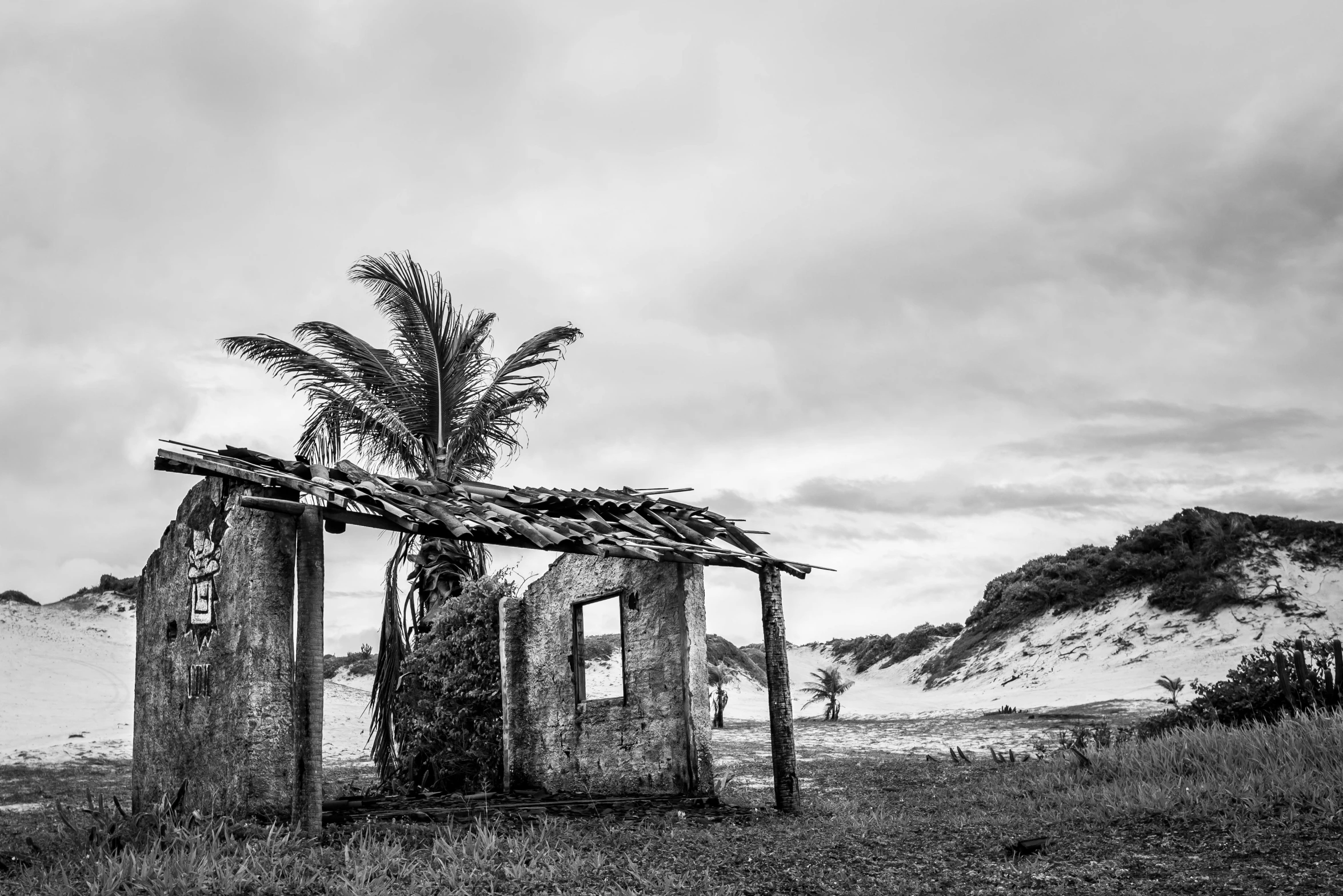 two old run down buildings in the countryside