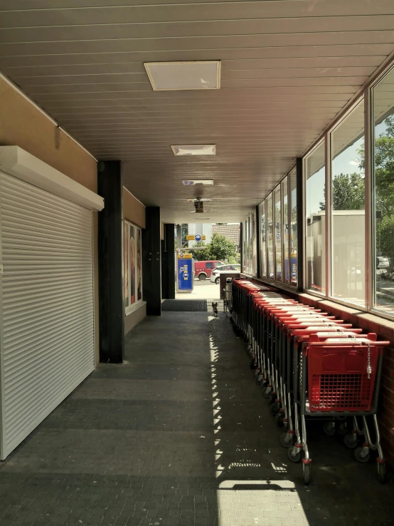 a row of shopping carts in an empty store