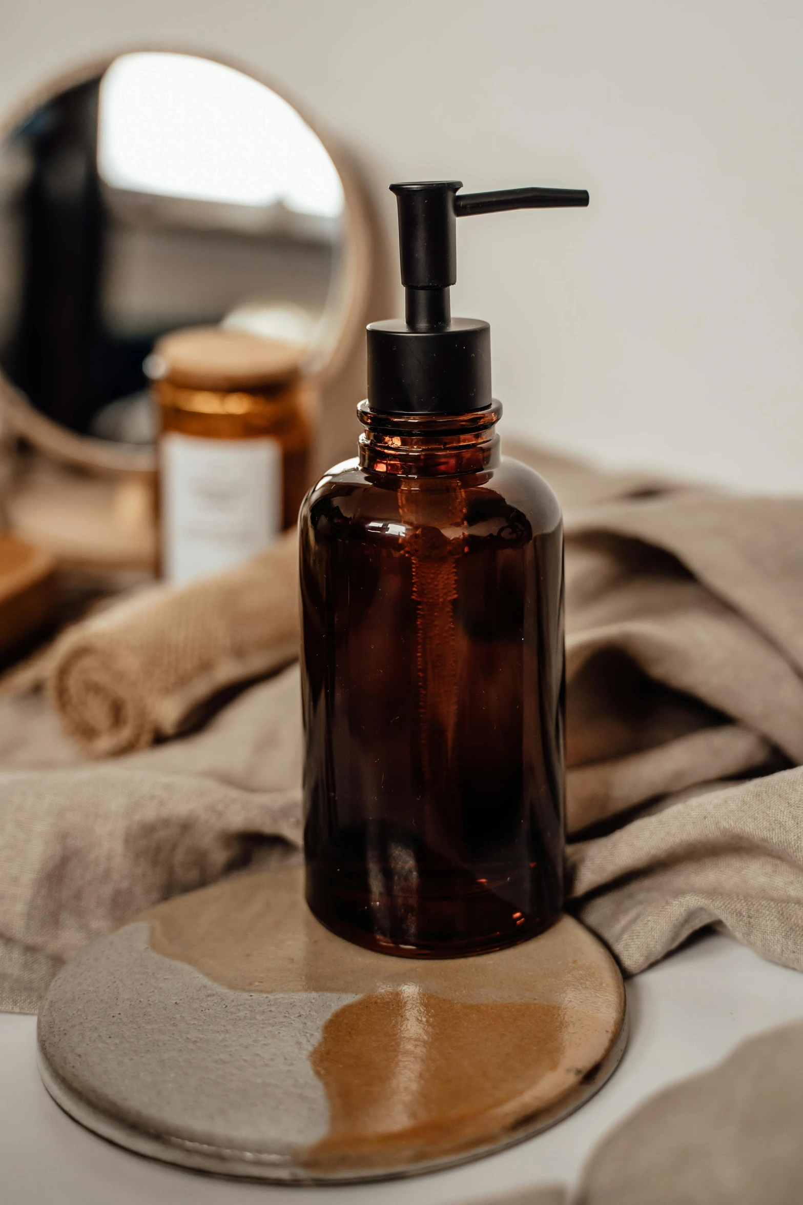 the bottle is full of liquid on the bathroom counter