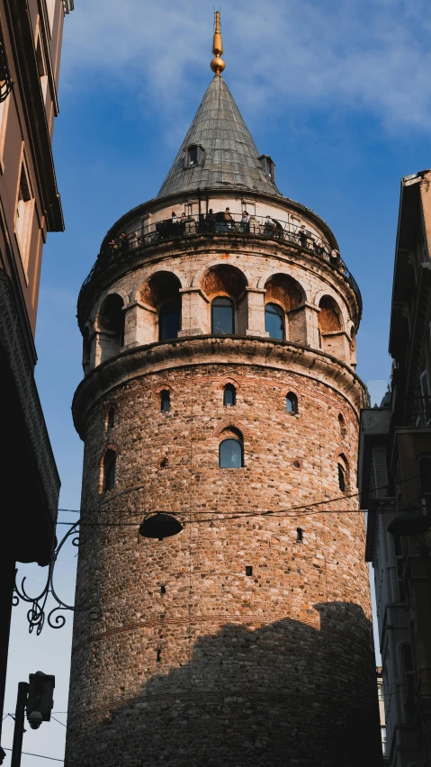 a tall tower sitting between two buildings in the city