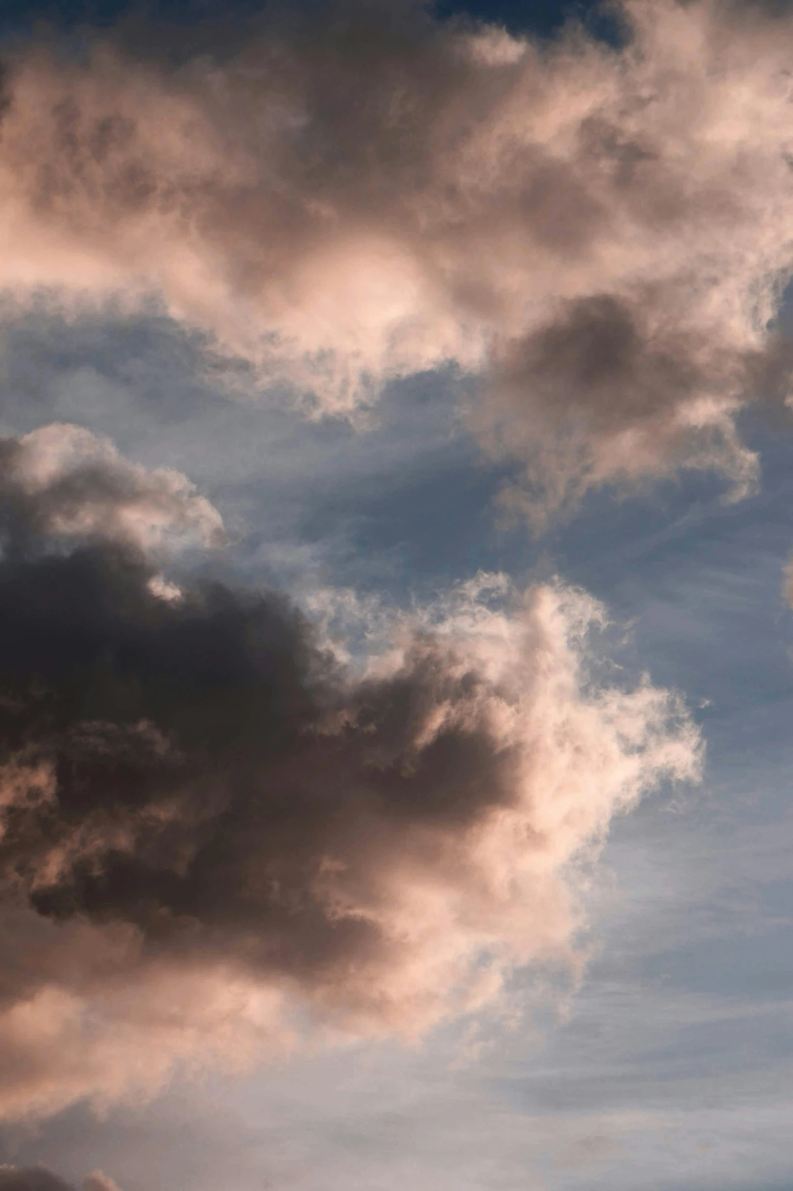 two planes flying near each other through cloudy skies