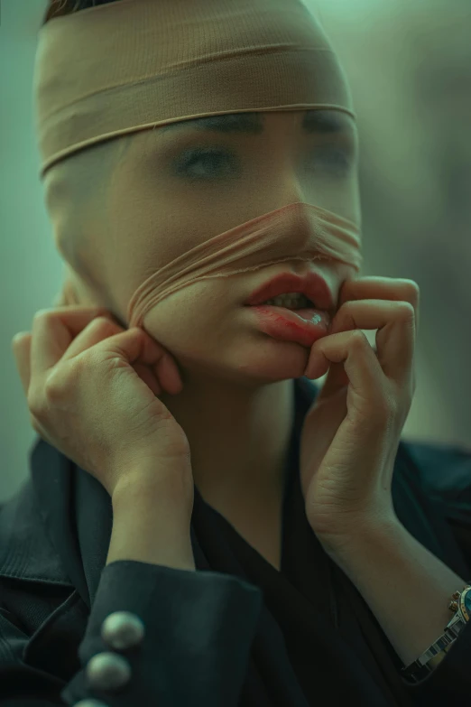 a woman with a blindfold covering her eyes