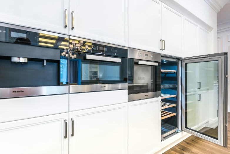 an empty and modern kitchen has glass doors