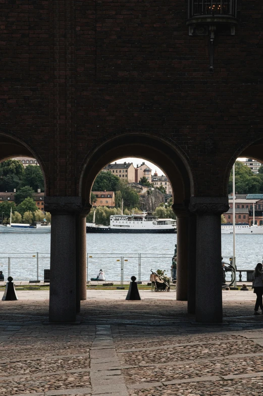 there is an archway leading to the water