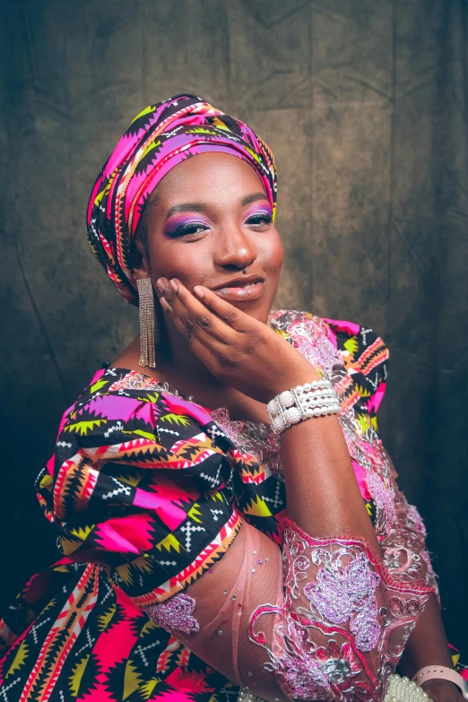 a woman poses for a pograph wearing a colorful outfit