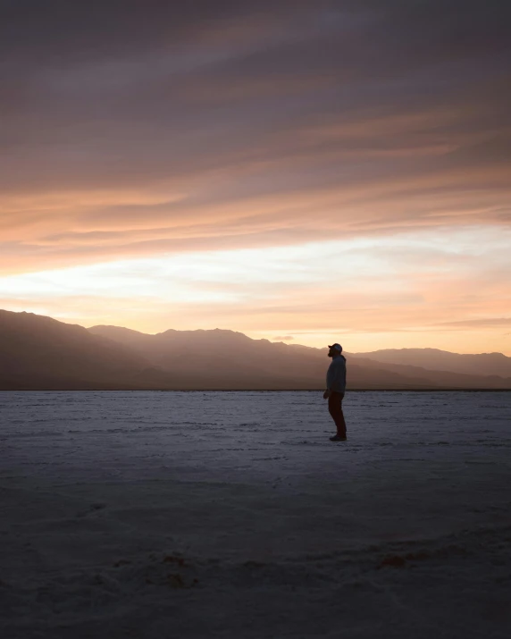 a person stands in an empty body of water