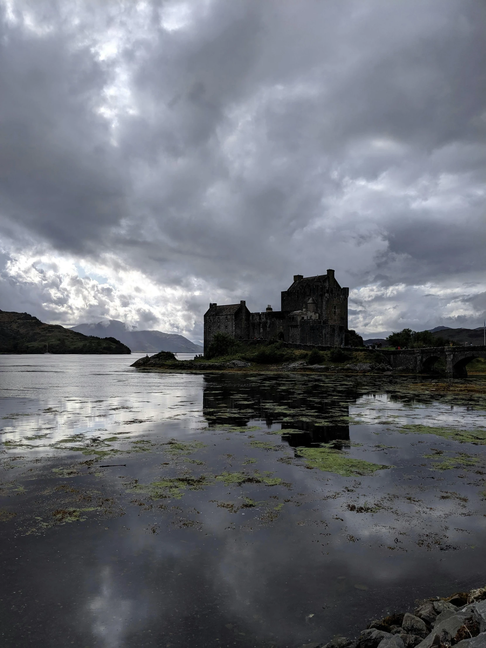 an old castle sitting on top of a large body of water