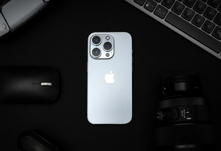 an apple product sitting on top of a desk next to a computer mouse