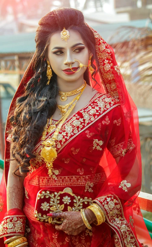 a woman dressed in red poses for a po