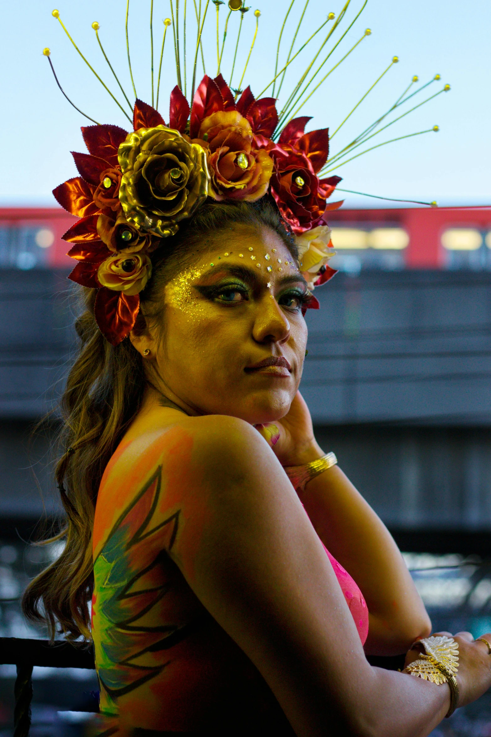 a woman with face paint and flowers in her hair