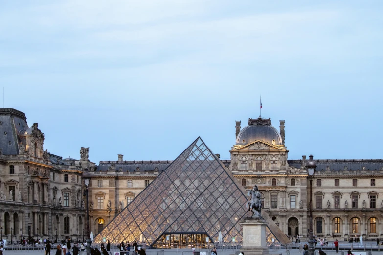 the eiffel tower with the pyramid in the background