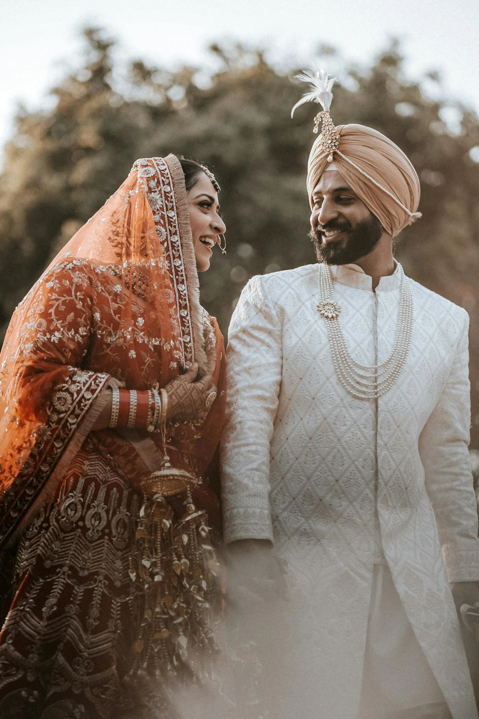 a couple in indian outfits standing together