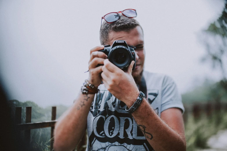 a man takes his picture in the mirror of his camera