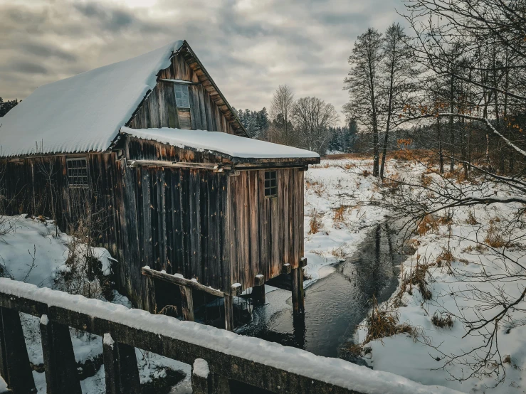 an old building is partially covered by some snow