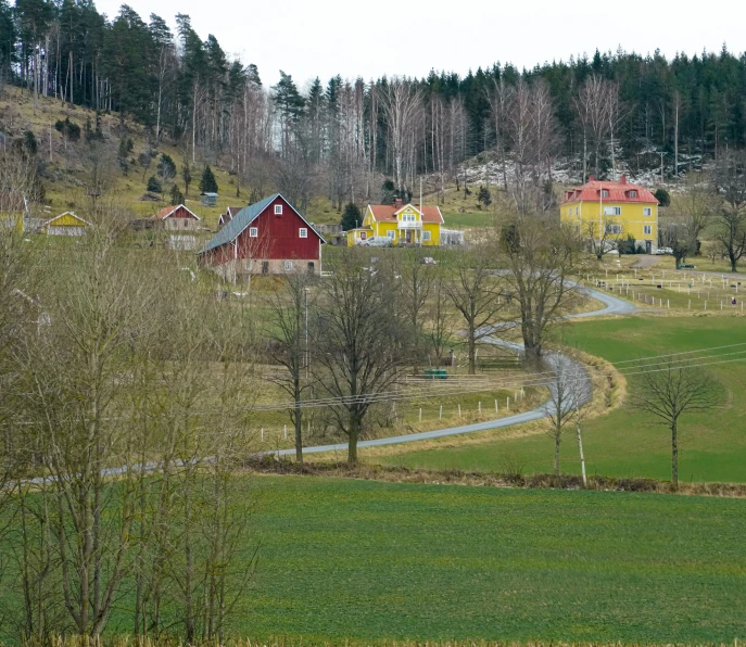 small village with lots of houses sitting on the hill