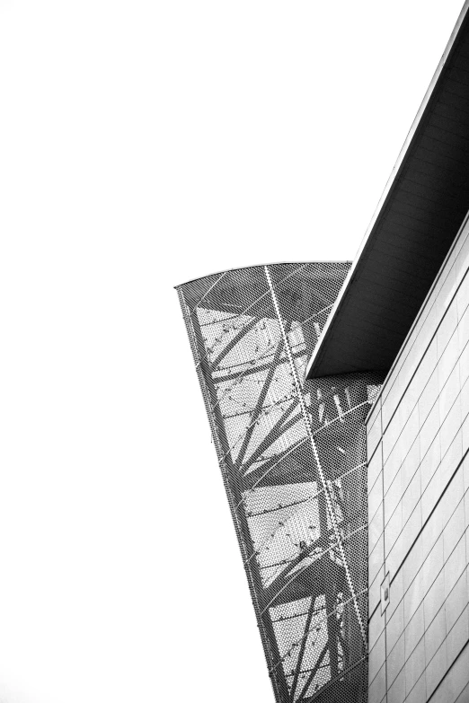 looking up from under a tower with an angled roof