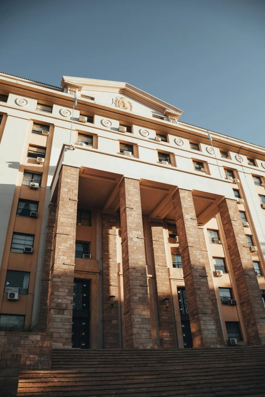 a tall building with multiple levels and a stair case next to it