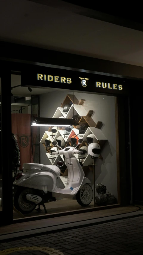 a scooter is shown behind a display case