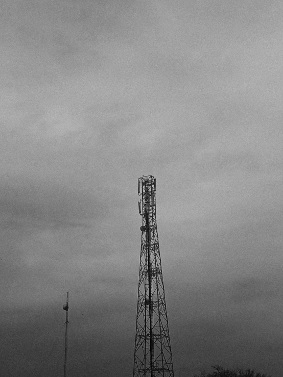 a very tall tower in front of a very cloudy sky