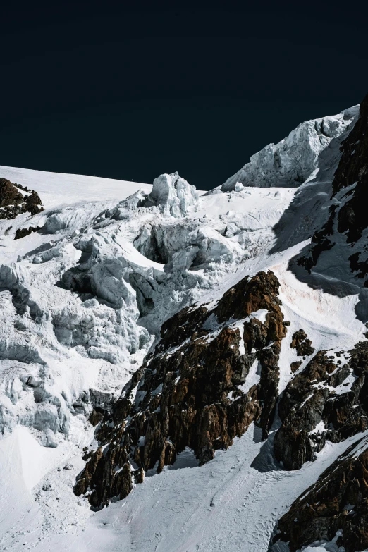 skiers making their way down the mountain pass