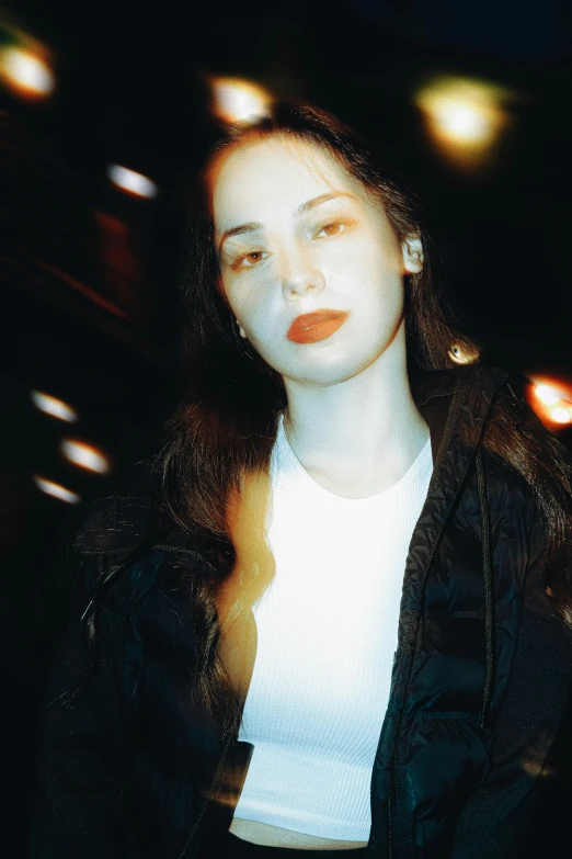 a woman looking away from the camera in a blurry background