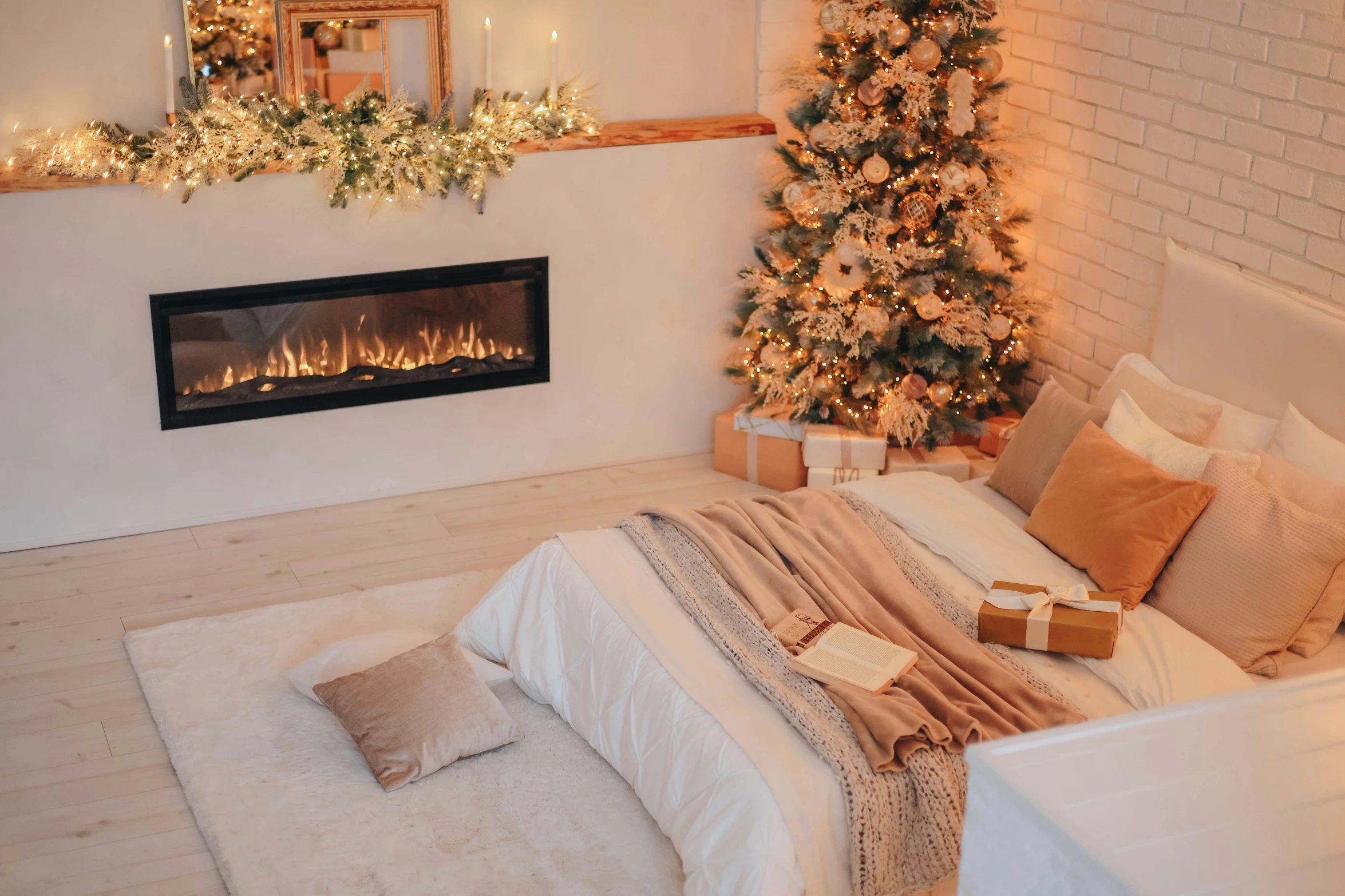 this bedroom is lit up with a white holiday tree