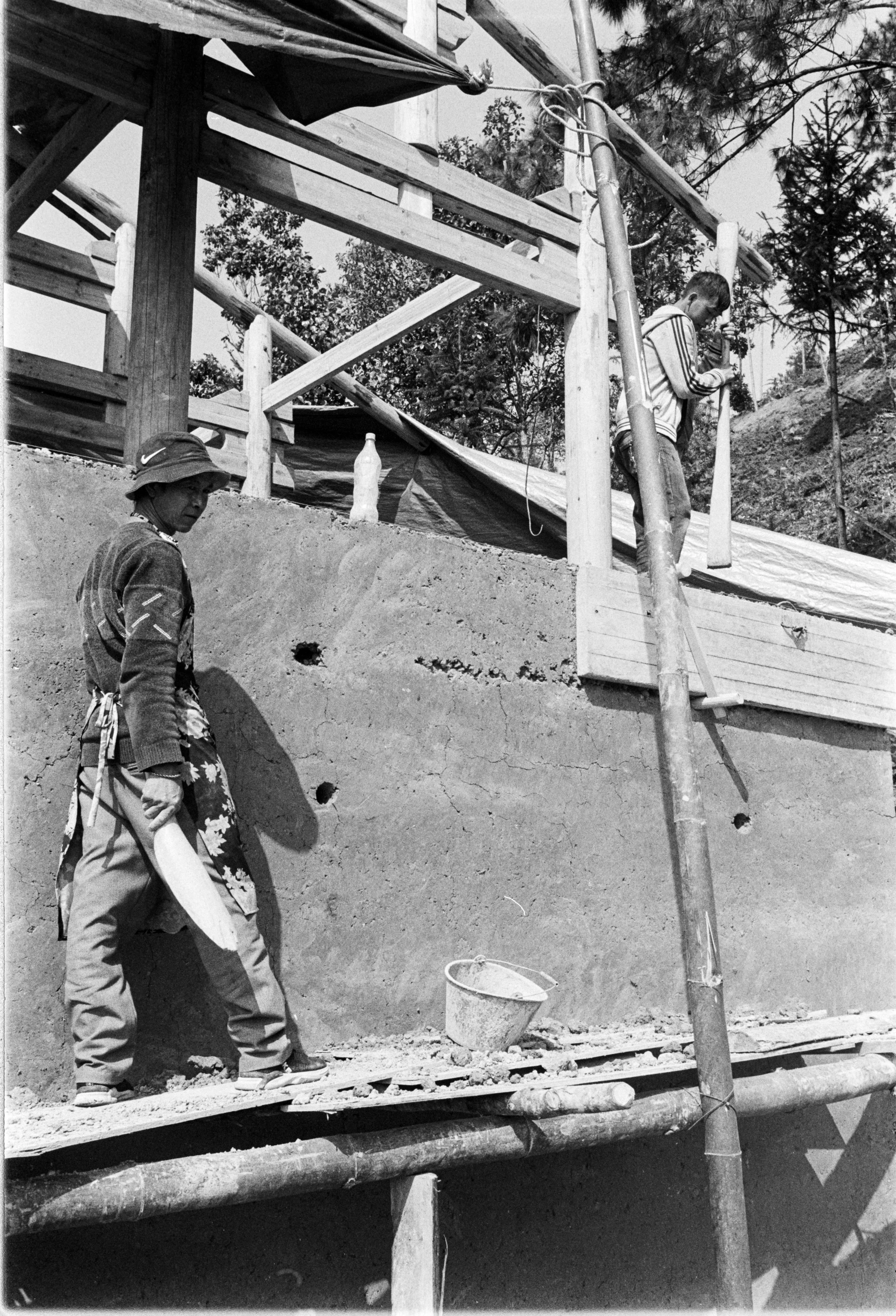 a man is walking up a wooden ramp