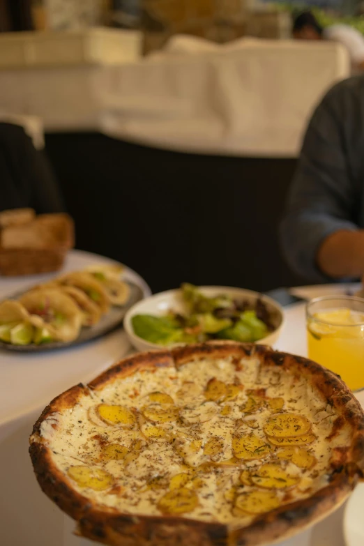 some food on a table with two glasses