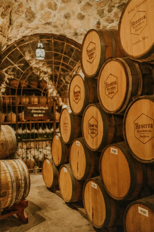 a bunch of wine barrels sitting next to each other