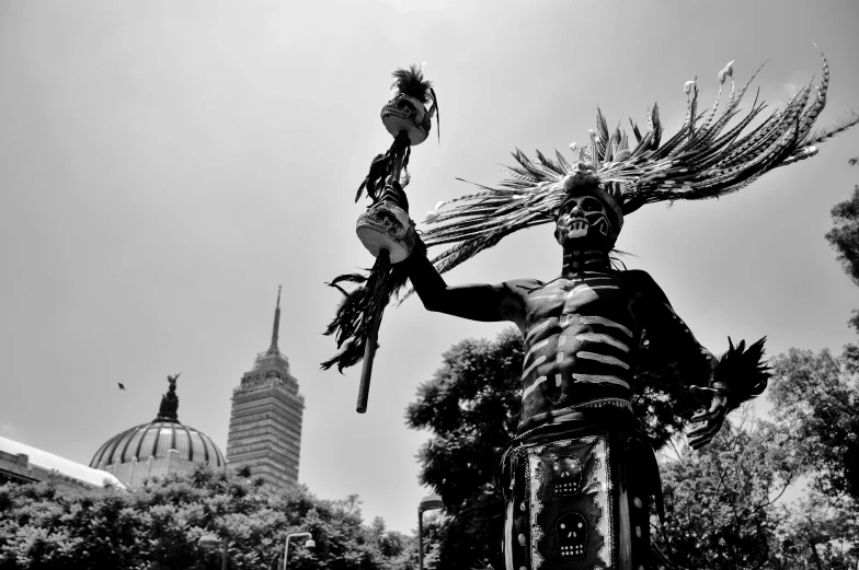 a statue that is sitting under some sort of sky