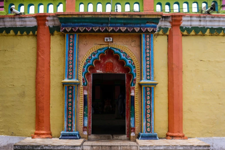 a colorful building with a fire hydrant next to it