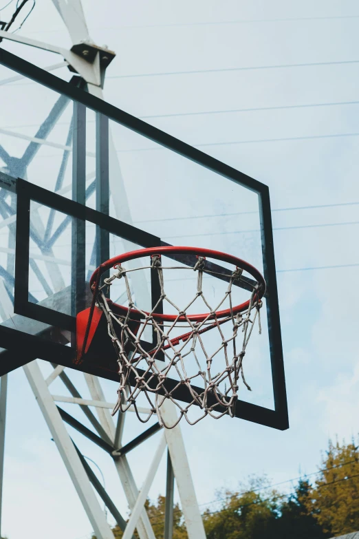 a basketball net with a ball coming out