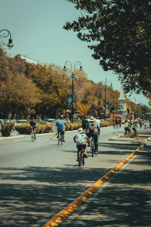 people are riding bikes on the side of a road