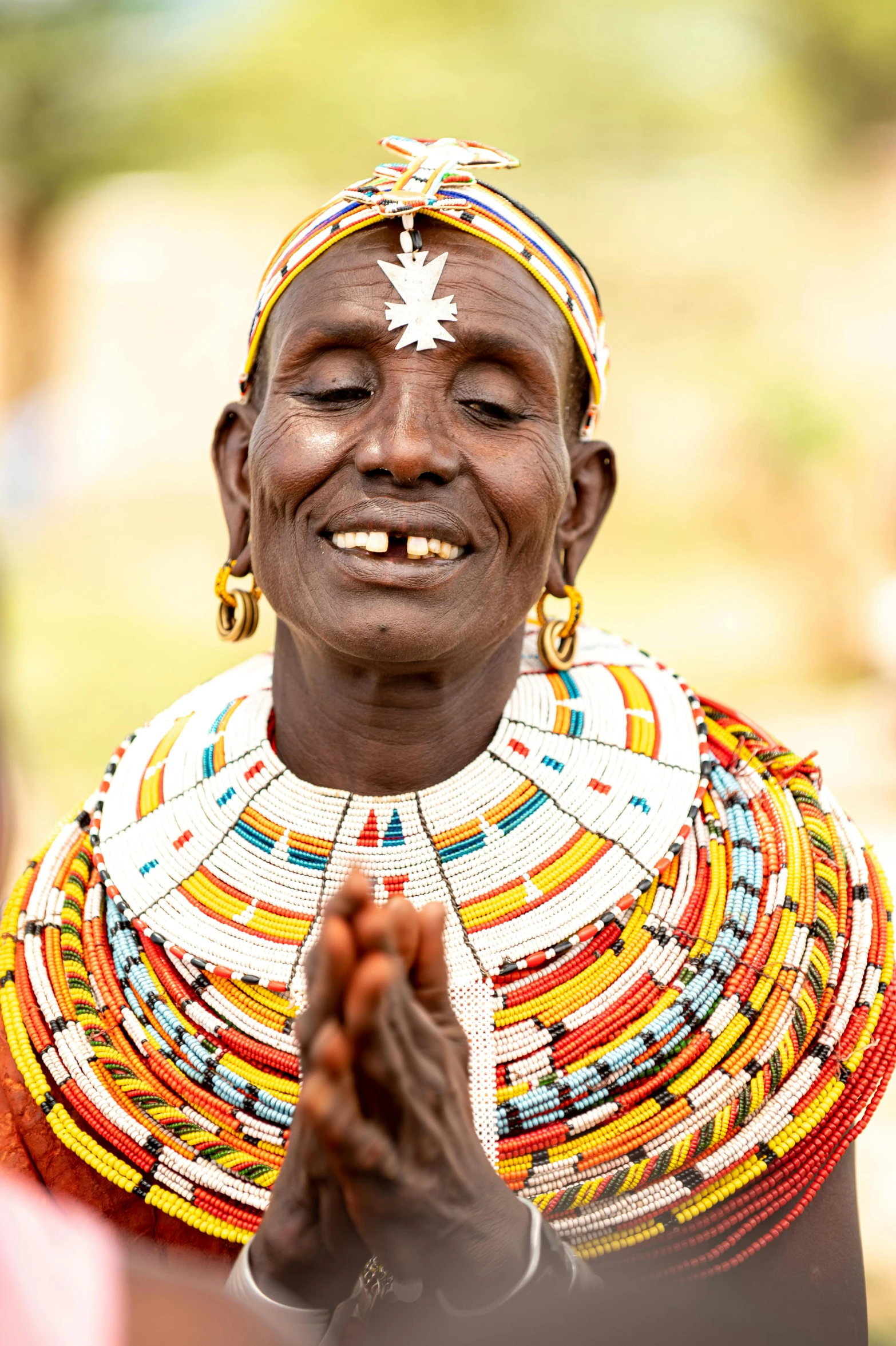 a woman in costume clapping with her hands